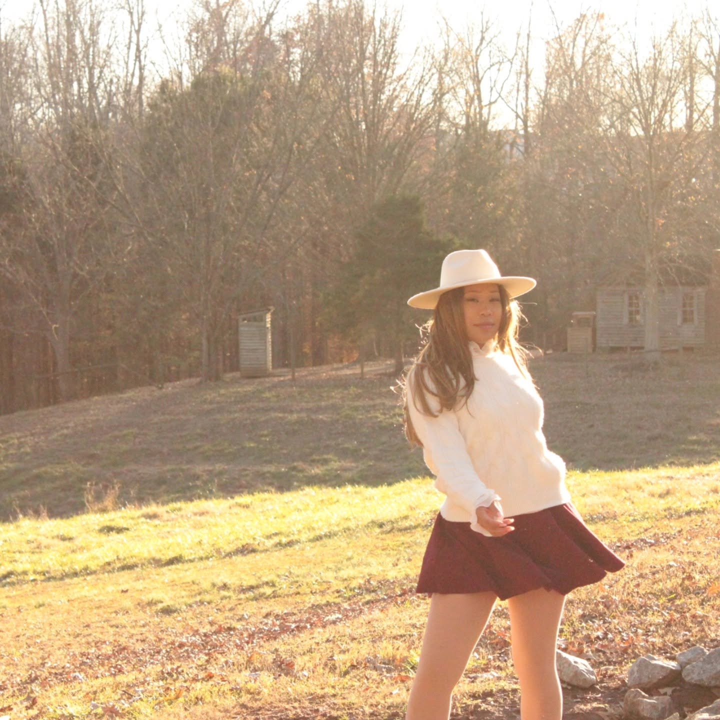 Dorothy Tobias-Williams walking outdoors at golden hour.